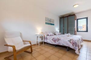 A bed or beds in a room at Villa Orquidea