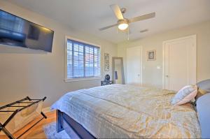 a bedroom with a bed and a ceiling fan at Winter Haven Abode Near Lakes and Attractions in Winter Haven