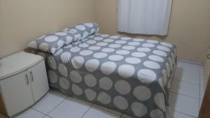 A bed or beds in a room at Apartamento Caucaia-CE, próximo á praia de Cumbuco