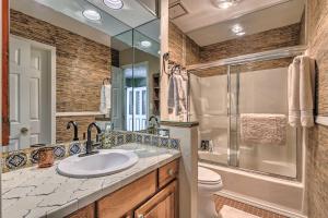 a bathroom with a sink and a shower and a toilet at Eclectic Home with Deck 4 Miles to Ski Cloudcroft! in Cloudcroft +16 photos