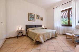 Ένα ή περισσότερα κρεβάτια σε δωμάτιο στο Casa Gemma - apartment with garden