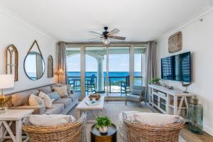 a living room with a couch and a table at 3 Portofino 1406 in Pensacola Beach