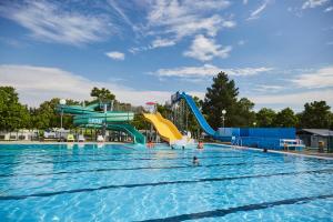 a swimming pool with a water park with a water slide at THERMAL RESORT LENDAVA - Terme Lendava, Hotel in Lendava