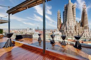 a balcony with a view of the cathedral at Sercotel Hotel Rosellon in Barcelona