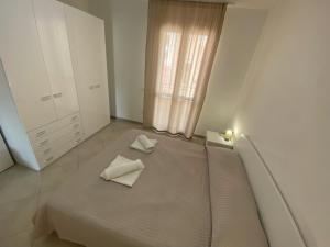 A bed or beds in a room at Appartamento Carlo Alberto