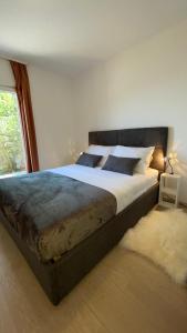 Postel nebo postele na pokoji v ubytování Villa Evita Apartments