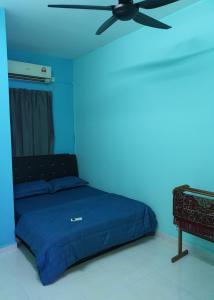 Postel nebo postele na pokoji v ubytování Homestay Layang