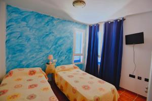 Postel nebo postele na pokoji v ubytování MARLOP´S ROOMS