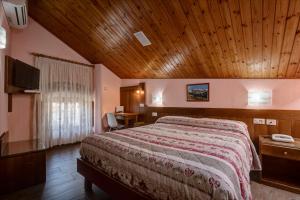Postel nebo postele na pokoji v ubytování Hotel Cecchin