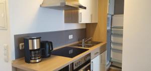 a kitchen with a coffee maker on a counter at Ferienwohnung März in Seebruck