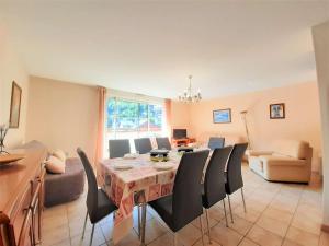 a dining room with a table and chairs at Appartement Saint-Lary-Soulan, 4 pièces, 9 personnes - FR-1-457-181 in Saint-Lary-Soulan