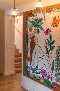 a mural on the wall of a room with stairs at Mikasa Ibiza Boutique Hotel ADULTS ONLY in Ibiza Town