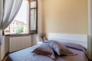 Ένα ή περισσότερα κρεβάτια σε δωμάτιο στο Mazzini Apartment +10 φωτογραφίες