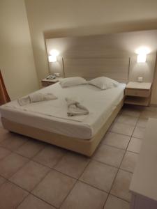 Postel nebo postele na pokoji v ubytování Saint Nicholas Hotel