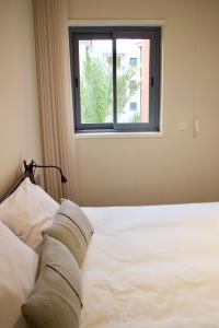 Katil atau katil-katil dalam bilik di Victoria Gardens Luxury Apartment