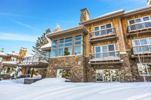 a house with snow in front of it at Luxury Five Bedroom Private Home with stunning Park City views home in Park City