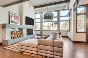a living room with a couch and a fireplace at Luxury Five Bedroom Private Home with stunning Park City views home in Park City