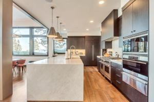 a kitchen with a large island in the middle at Luxury Five Bedroom Private Home with stunning Park City views home in Park City