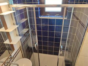 a bathroom with a shower with a toilet and a window at ALTANA in Torraca +29 photos