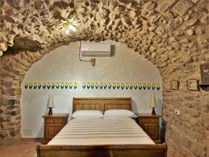 Postel nebo postele na pokoji v ubytování Mas Tulsà Casa Rural Girona