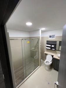 a bathroom with a shower and a toilet at Hotel Wanderlust in Santa Marta +37 photos