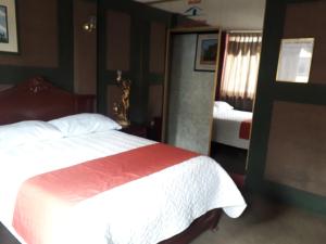 Postel nebo postele na pokoji v ubytování Hotel Tungurahua
