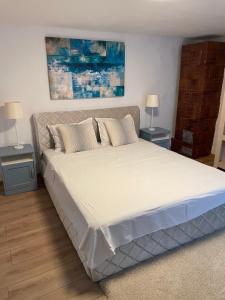 En eller flere senge i et værelse på Casa Arts Vadu