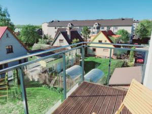 a balcony with a view of a yard at Studio SunSet in Pärnu