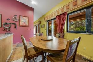 a dining room with a wooden table and chairs at Four Queens in Chapel in Sedona