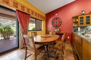 a dining room with a wooden table and chairs at Four Queens in Chapel in Sedona