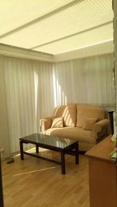 a living room with a couch and a coffee table at Beeston House in Thornton