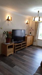a living room with a large flat screen tv at Beeston House in Thornton