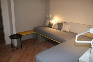 A bed or beds in a room at Loft 33