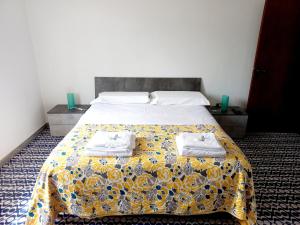 A bed or beds in a room at Appartamento Degli Dei (Affittacamere)