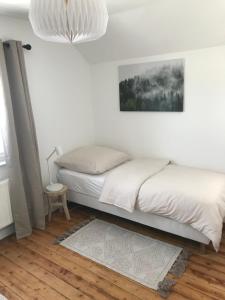Postel nebo postele na pokoji v ubytování Ferienhaus Eifeldömchen