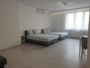 Łóżko lub łóżka w pokoju w obiekcie Center Warsaw- Apartamenty Smolna