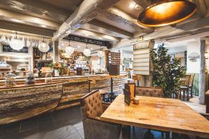 a restaurant with wooden tables and chairs and a bar at Bayards Cove Inn in Dartmouth