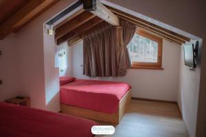 Katil atau katil-katil dalam bilik di Dolomiti RiverSide