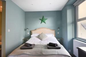 Un pat sau paturi într-o cameră la Avocet