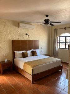 Postel nebo postele na pokoji v ubytování HOTEL CASA DE LAS PALOMAS