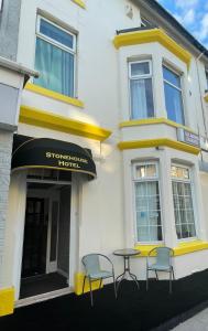 a table and chairs in front of a building at The Stone House Hotel in Blackpool +16 photos