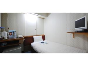 a room with a bed and a tv on a wall at Rico Hotel Kokura - Vacation STAY 22584v in Kitakyushu