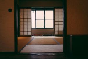an open door to a room with a window at Kyoto Machiya Tabijuku Kotoon - Vacation STAY 30119v in Kyoto