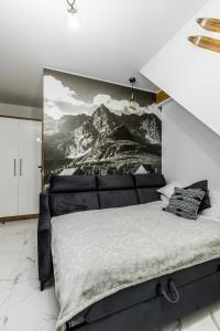 Posteľ alebo postele v izbe v ubytovaní Apartament Modrzejewska