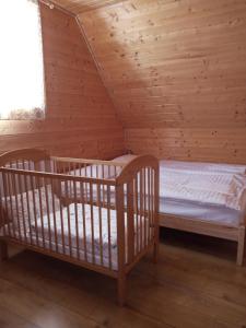 En eller flere senge i et værelse på Chata Drevenica Orava