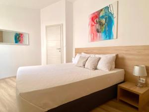 Postel nebo postele na pokoji v ubytování Golden Apartments