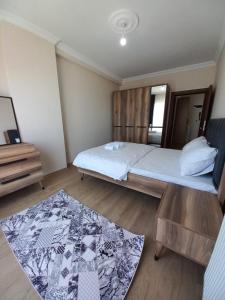 Ein Bett oder Betten in einem Zimmer der Unterkunft Kıvanç Residence