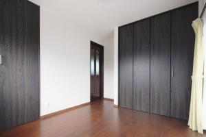 a room with dark wood cabinets and a hallway at Nagatoro fireplace - Vacation STAY 59551v in Minano