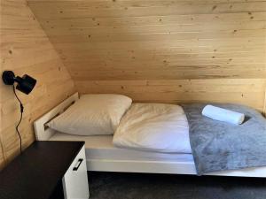 Postel nebo postele na pokoji v ubytování Chata "na Końcu" Świata