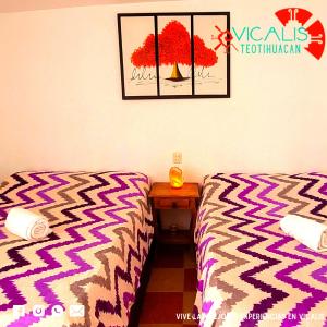 Ліжко або ліжка в номері Hotel Vicalis & Restaurante